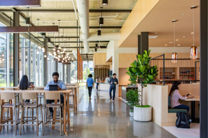 Modern Office with exposed ceiling and people working