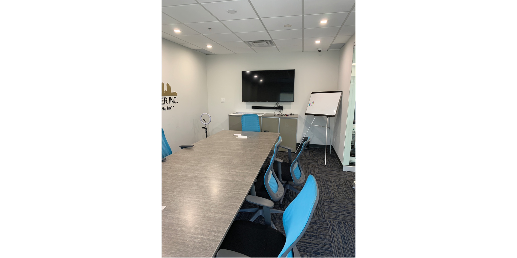 16 McAdam Avenue Boardroom with large table, chairs and TV