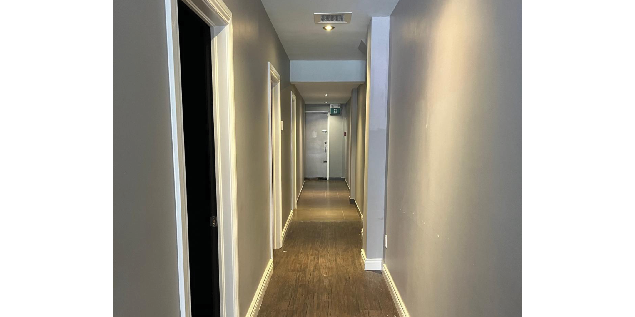 Hallway with lights and doors