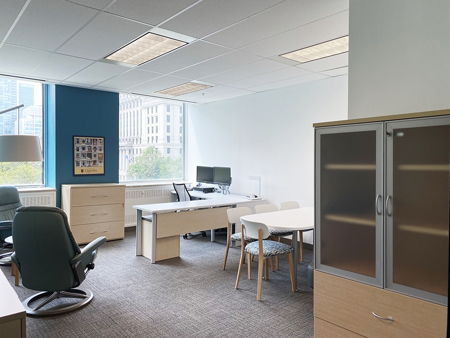 375 University Avenue work space with several desks, chairs and cabinets