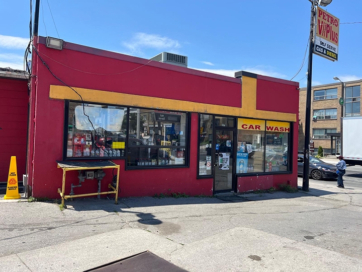 1525 Eglinton Avenue store exterior with a car wash sign on the window