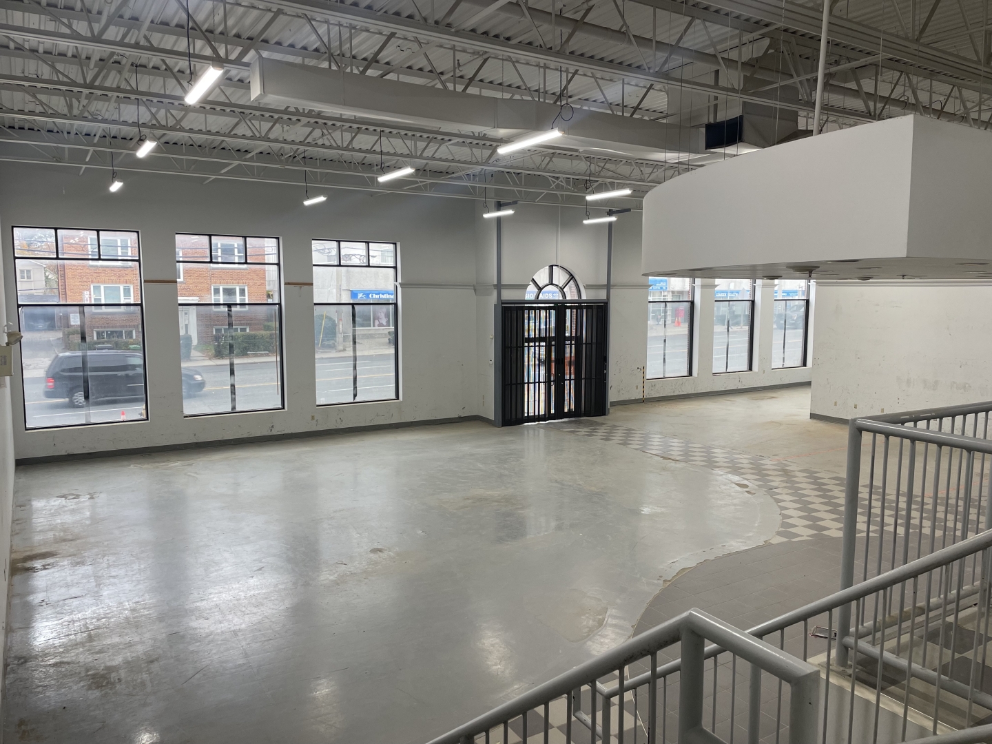 832 Eglinton Avenue vacant interior space with huge windows fronting the street