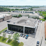 1200 Stellar Drive Building Aerial with lots of parking space